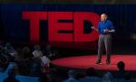 Steve Long speaking on a stage with the word TED behind him